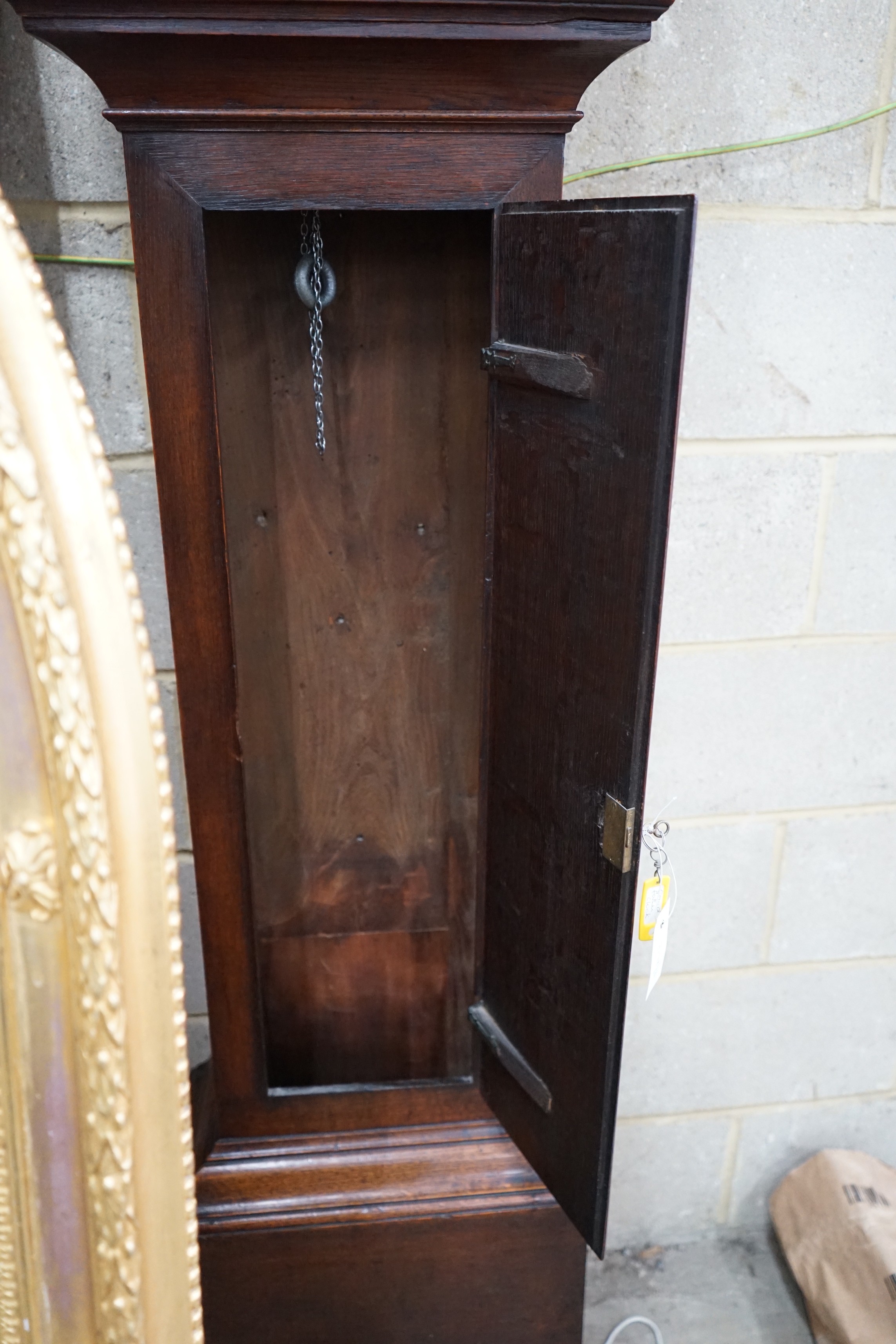 A George III oak 30 hour longcase clock, brass dial marked Amos Kelsall, Hereford, height 220cms.